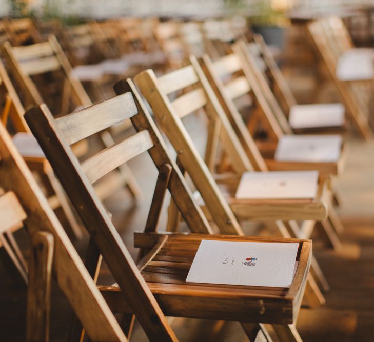 Warehouse Wedding With Wooden Chairs & Foliage Installation | Images by Frances Sales