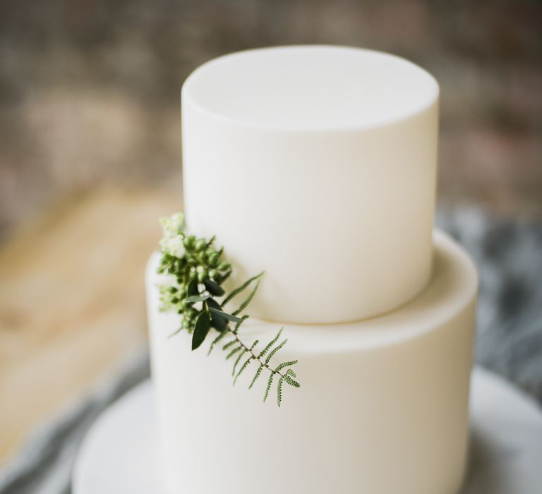 Elegant White Wedding Cake With Foliage