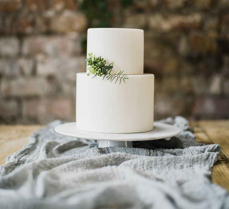 Elegant White Wedding Cake With Foliage