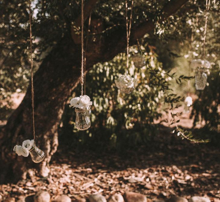 Hanging Vases Filled with Flowers