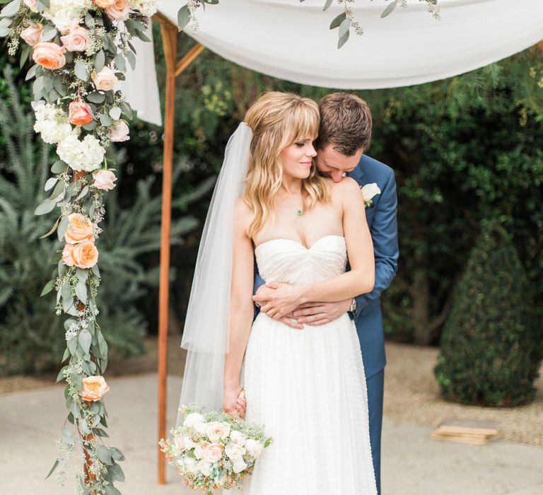 Bride & Groom Portrait Under a Floral Arch