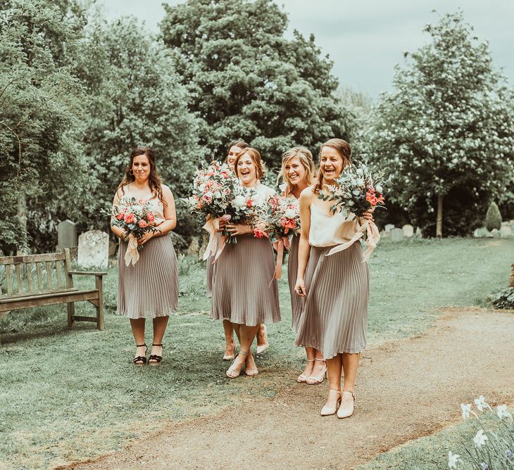 Bridesmaids in Pleated TFNC Skirts | DIY At Home Marquee Reception | Jess Soper Photography