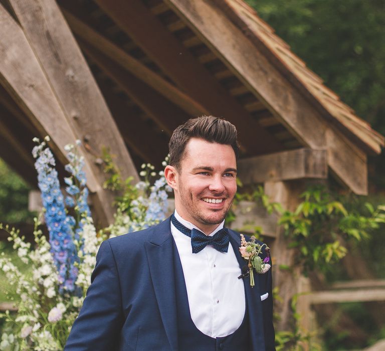 Groom In Navy Three Piece Suit With Bow Tie