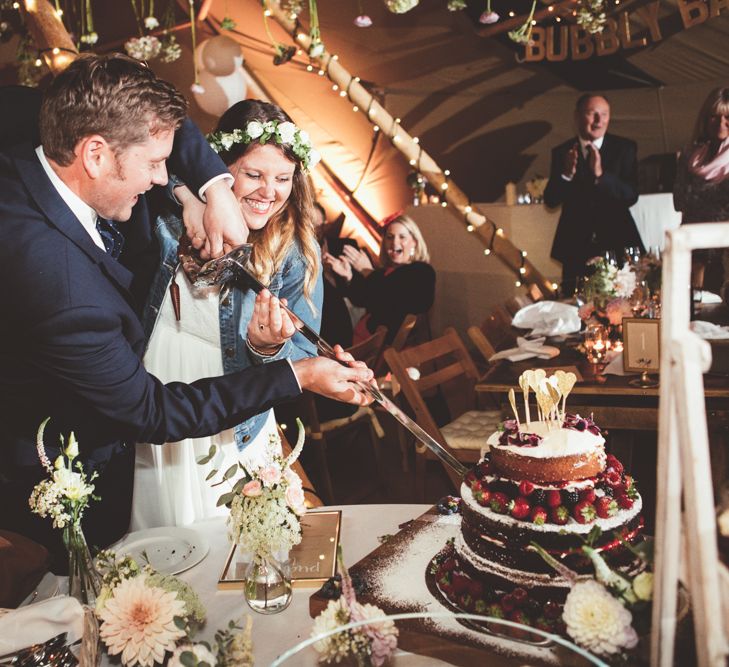 Cutting The Homemade Naked Wedding Cake | Bride in Something Old Something New Bridal Gown | Groom in Marks and Spencer Suit | Maryanne Weddings Photography