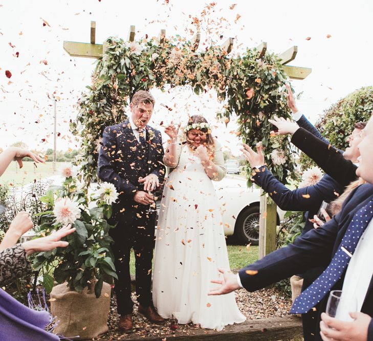 Floral Arch | Bride in Something Old Something New Bridal Gown | Groom in Marks and Spencer Suit | Maryanne Weddings Photography