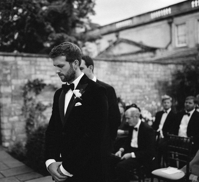 Groom Waiting At End Of Aisle