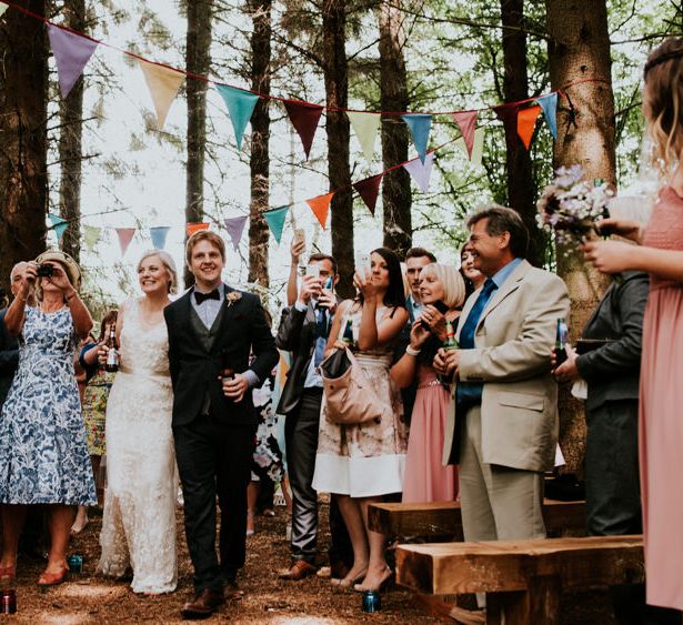 Woodland Wedding Ceremony | Bride in Catherine Deane Gown | Groom in Ben Sherman Suit, Bow Tie & Gingham Shirt | Colourful Outdoor Wedding at Lineham Farm in Leeds | Shutter Go Click Photography