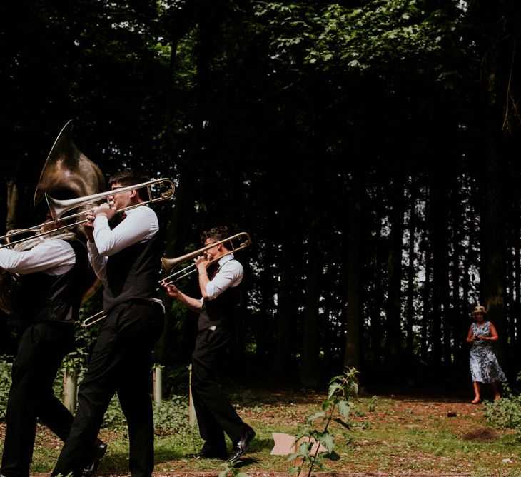 Brass Band Procession | Bride in Catherine Deane Gown | Groom in Ben Sherman Suit, Bow Tie & Gingham Shirt | Colourful Outdoor Wedding at Lineham Farm in Leeds | Shutter Go Click Photography