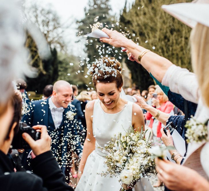 Confetti Exit | Bride in Pronovias Tami Wedding Dress | Groom in Blue Moss Bros Suit | Michelle Wood Photography