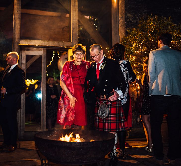 Fire Pit | Cripps Stone Barn | Groom in Blue Moss Bros Suit | Michelle Wood Photography