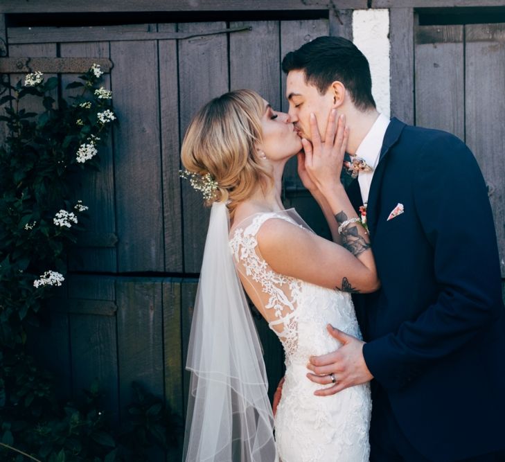 Bride in Lace Illusion Neck Wedding Dress | Groom in Next Suit | Dale Weeks Photography