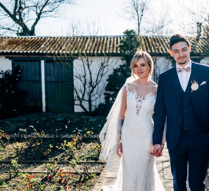 Bride in Lace Illusion Neck Wedding Dress | Groom in Next Suit | Dale Weeks Photography