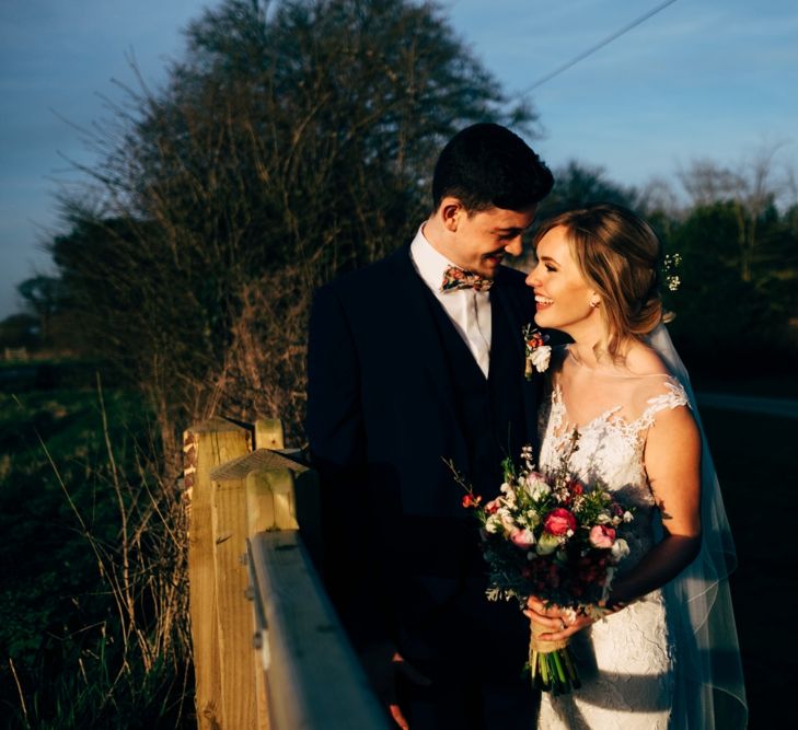 Bride in Lace Illusion Neck Wedding Dress | Groom in Next Suit | Dale Weeks Photography