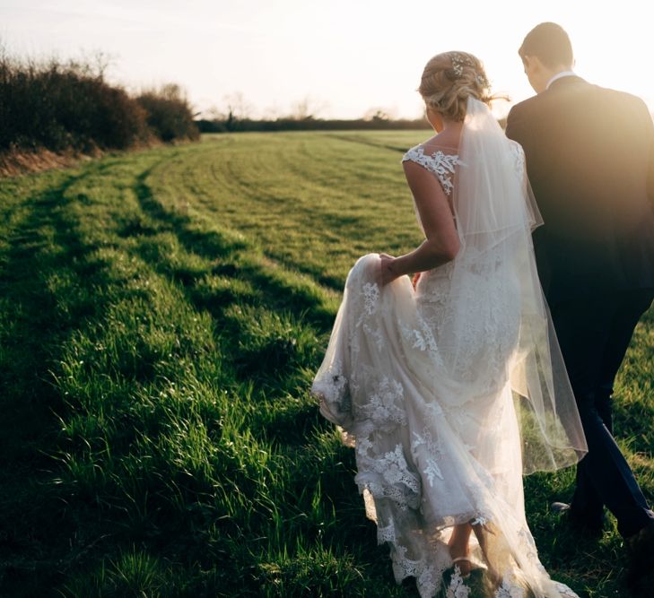 Bride in Lace Illusion Neck Wedding Dress | Groom in Next Suit | Dale Weeks Photography