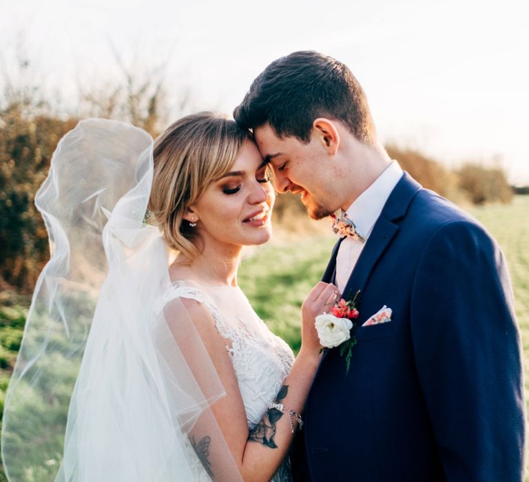 Bride in Lace Illusion Neck Wedding Dress | Groom in Next Suit | Dale Weeks Photography