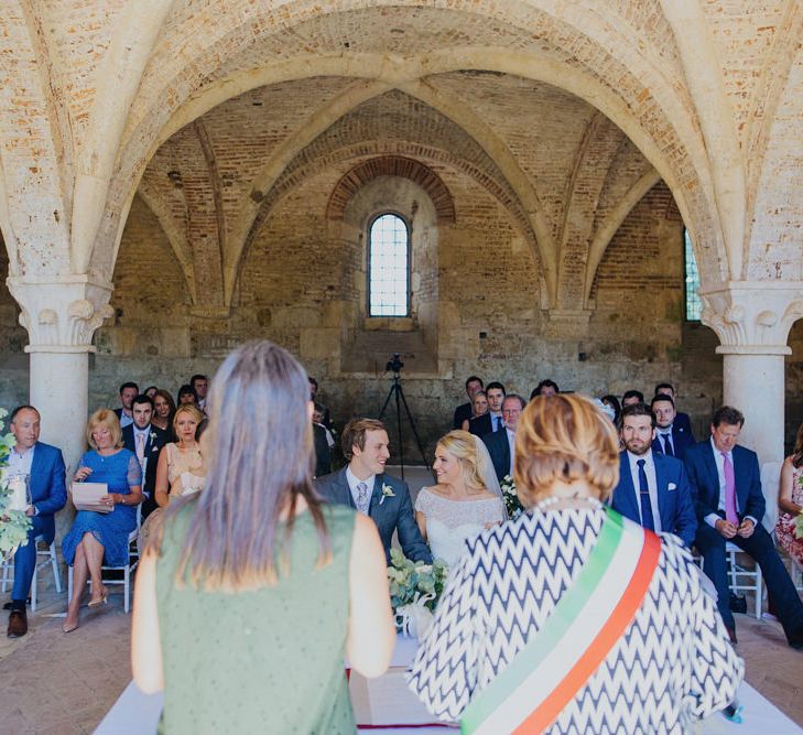 Bride in Justin Alexander Wedding Dress | Groom in Gresham Blake Suit | Outdoor Destination wedding at San Galgano Abbey, near Siena | Lush Imaging | Mrs Mash Up Films