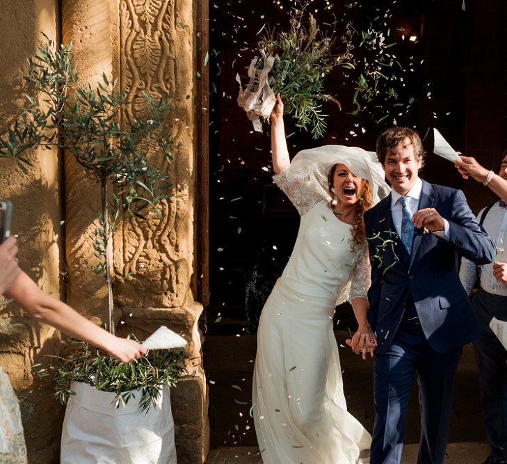 Confetti Exit | Bride in Low Back Atelier Endeavour Gown | Groom in Hugo Boss Suit | Destination Wedding at Pienza, Italy | Nordica Photography