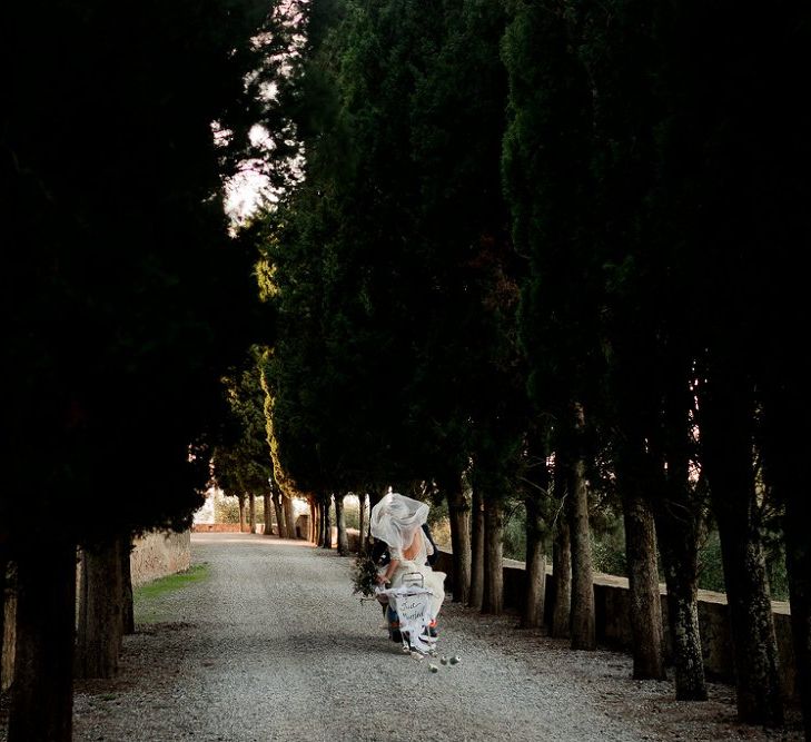 Vespa Wedding Transport | Bride in Low Back Atelier Endeavour Gown | Groom in Hugo Boss Suit | Destination Wedding at Pienza, Italy | Nordica Photography