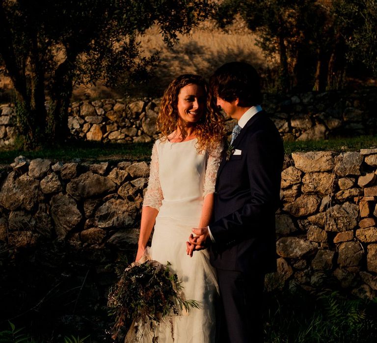 Bride in Low Back Atelier Endeavour Gown | Groom in Hugo Boss Suit | Destination Wedding at Pienza, Italy | Nordica Photography