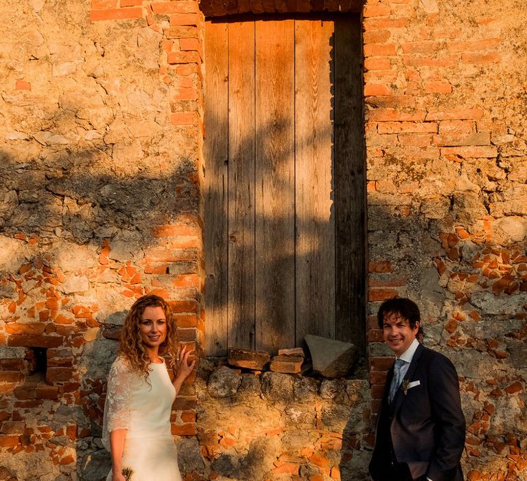 Bride in Low Back Atelier Endeavour Gown | Groom in Hugo Boss Suit | Destination Wedding at Pienza, Italy | Nordica Photography