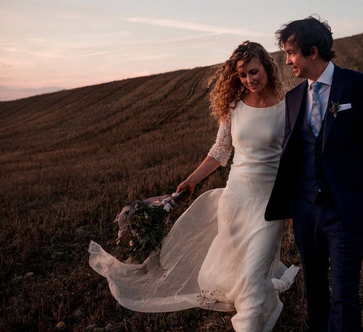 Bride in Low Back Atelier Endeavour Gown | Groom in Hugo Boss Suit | Destination Wedding at Pienza, Italy | Nordica Photography