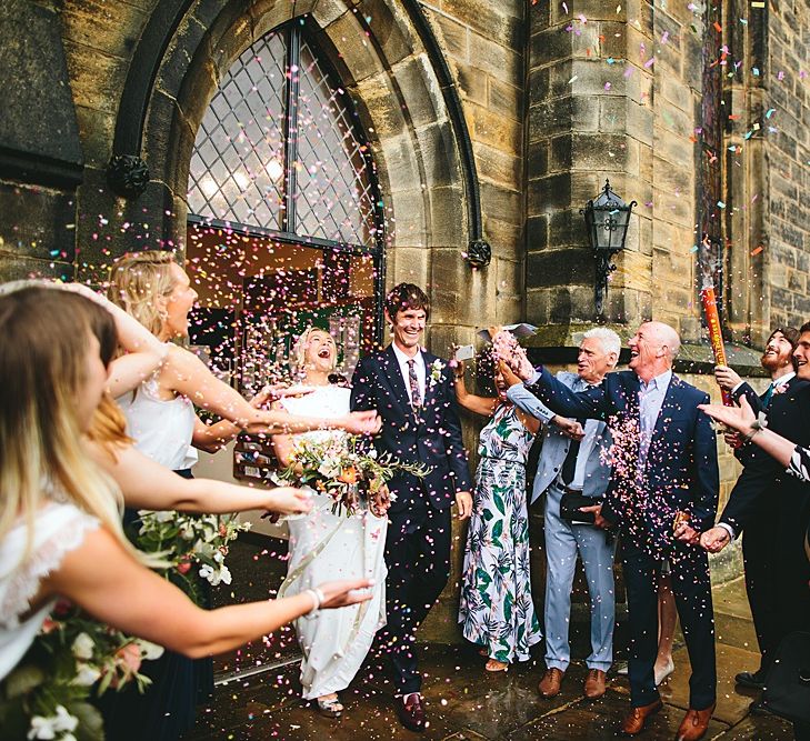 Confetti Moment | Bride in Bon Bride Bespoke Gown | Groom in Navy Paul Smith Suit | At Home Greenery Filled Marquee Wedding in Yorkshire | Craig Williams Photography