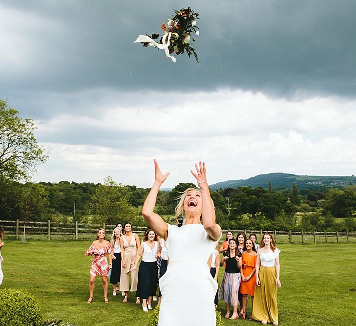 Bouquet Toss | At Home Greenery Filled Marquee Wedding in Yorkshire | Craig Williams Photography