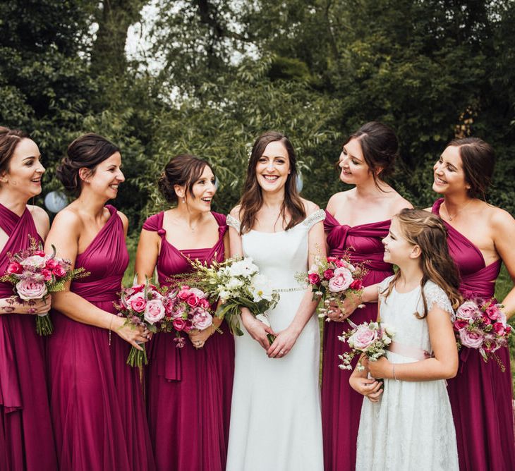 Raspberry, Gold & Navy Colour Palette Marquee Wedding With Suzanne Neville Bride & Bridesmaids In Raspberry Multiway Dresses Images From Michelle Wood