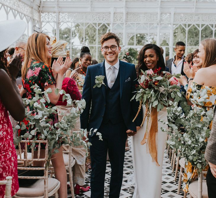 Wedding Ceremony | Bride in Charlie Brear Gown | Protea Bouquet | Groom in Moss Bros Suit | Botanical Orangery Wedding at Horniman Museum & Gardens, London | Fern Edwards Photography