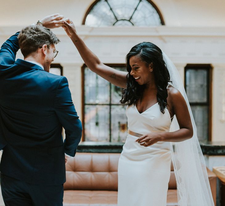 First Look | Bride in Charlie Brear | Groom in Moss Bros Suit | Botanical Orangery Wedding at Horniman Museum & Gardens, London | Fern Edwards Photography