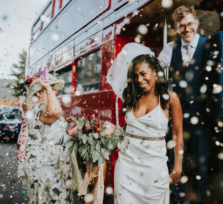 Confetti Exit | Bride in Charlie Brear Gown | Groom in Moss Bros Suit | London Bus Wedding Transport | Botanical Orangery Wedding at Horniman Museum & Gardens, London | Fern Edwards Photography