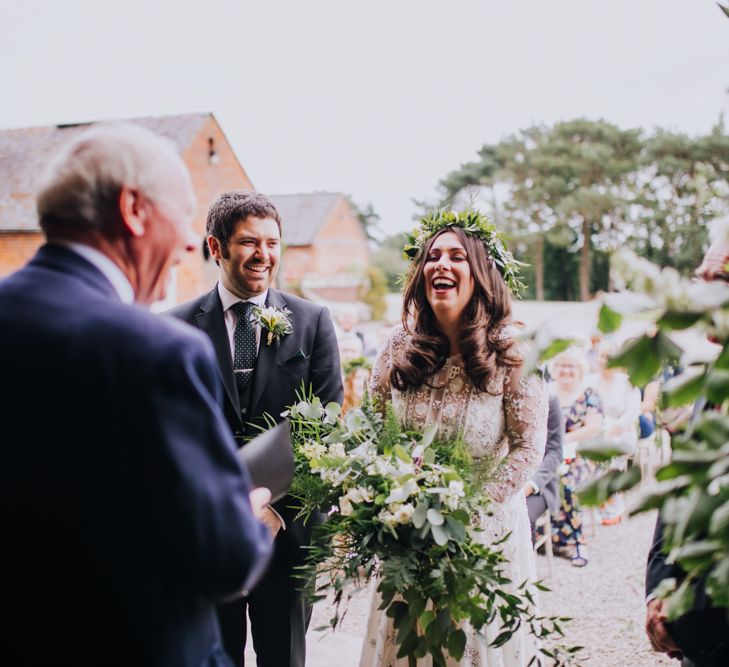 Outdoor Wedding Ceremony | Bride in Needle & Thread Bridal Gown | Groom in Ted Baker Suit | Rustic, Greenery Wedding at Pimhill Barns Shropshire | Clara Cooper Photography | Second Shooter Helen Jane Smiddy Photography