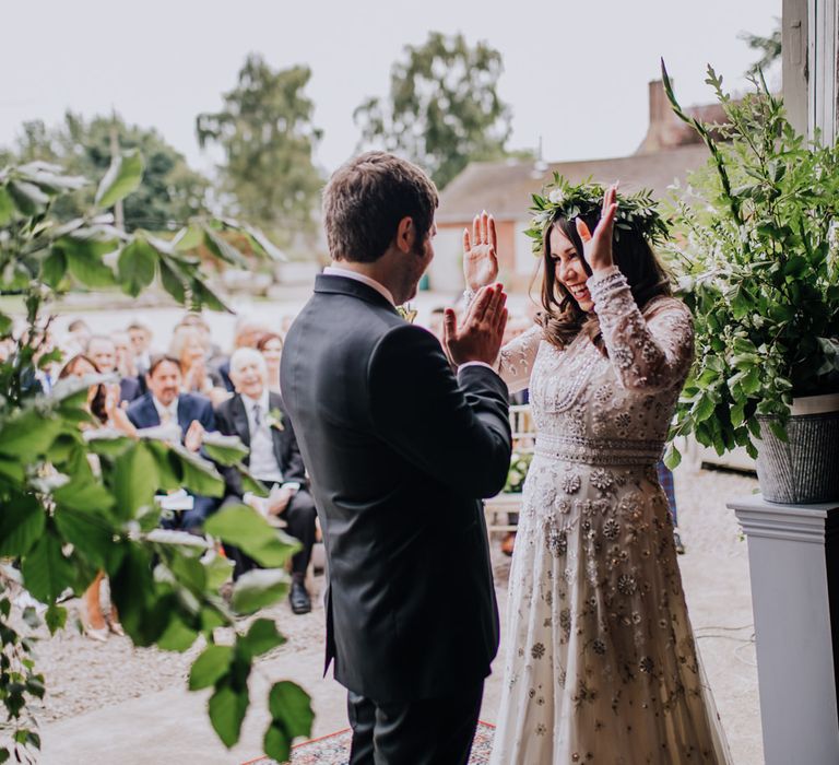 Outdoor Wedding Ceremony | Bride in Needle & Thread Bridal Gown | Groom in Ted Baker Suit | Rustic, Greenery Wedding at Pimhill Barns Shropshire | Clara Cooper Photography | Second Shooter Helen Jane Smiddy Photography