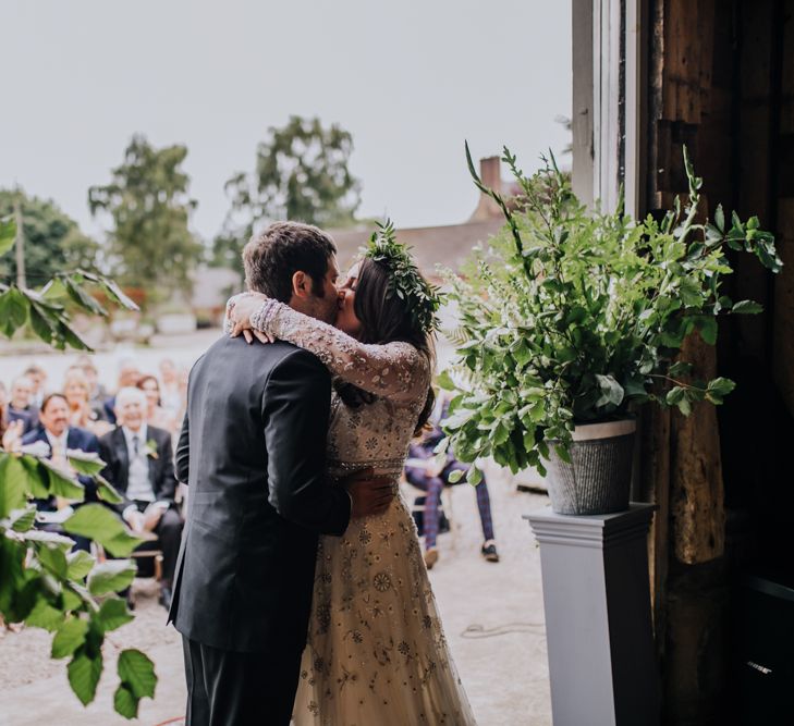 Outdoor Wedding Ceremony | Bride in Needle & Thread Bridal Gown | Groom in Ted Baker Suit | Rustic, Greenery Wedding at Pimhill Barns Shropshire | Clara Cooper Photography | Second Shooter Helen Jane Smiddy Photography