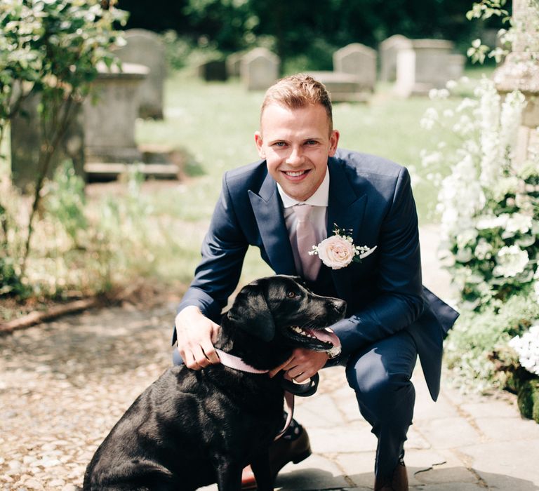 Groom in Navy Reiss Suit | Image by <a href="https://www.mandjphotos.com/" target="_blank">M&J Photography</a>