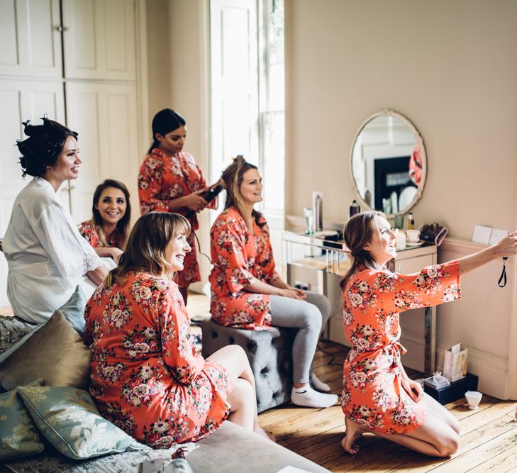 Bridesmaids Getting Ready In Floral Robes