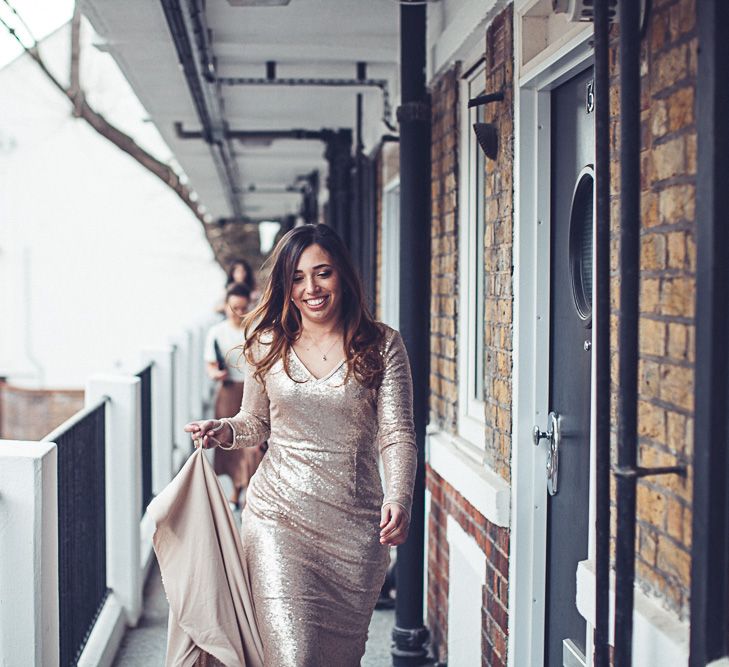 Bride In Gold Sequinned Dress For A Relaxed Wedding At Asylum Chapel With Bridesmaids In Mismatched High Street Dresses And Images by Lovestruck Photography