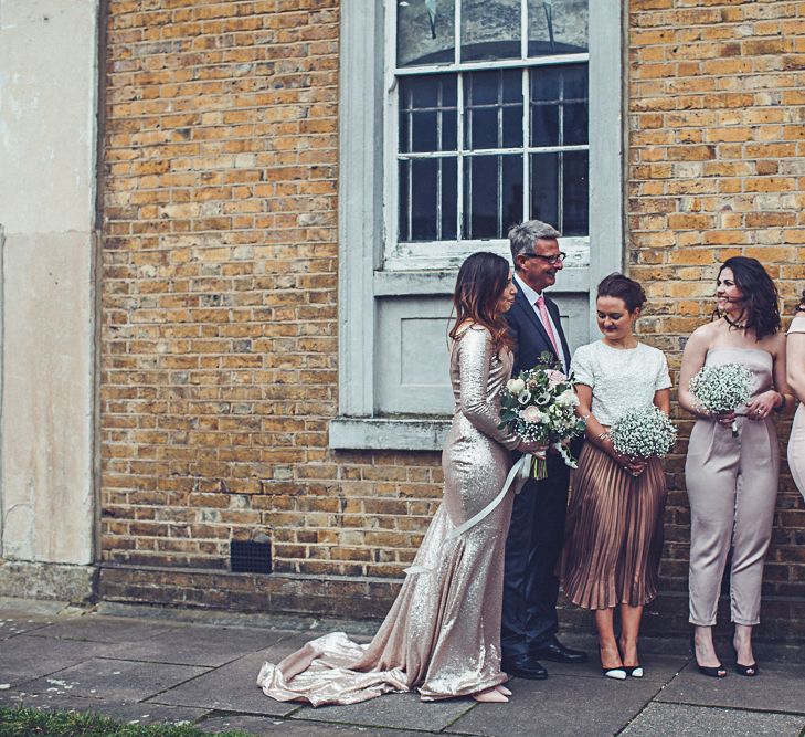 Bride In Gold Sequinned Dress For A Relaxed Wedding At Asylum Chapel With Bridesmaids In Mismatched High Street Dresses And Images by Lovestruck Photography