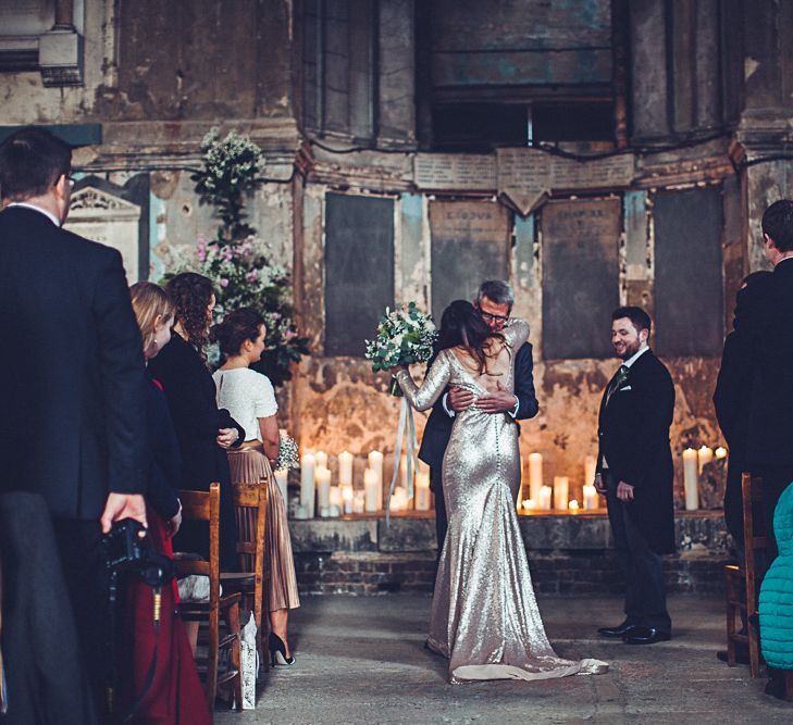 Bride In Gold Sequinned Dress For A Relaxed Wedding At Asylum Chapel With Bridesmaids In Mismatched High Street Dresses And Images by Lovestruck Photography