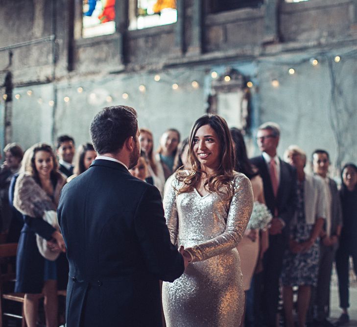 Bride In Gold Sequinned Dress For A Relaxed Wedding At Asylum Chapel With Bridesmaids In Mismatched High Street Dresses And Images by Lovestruck Photography