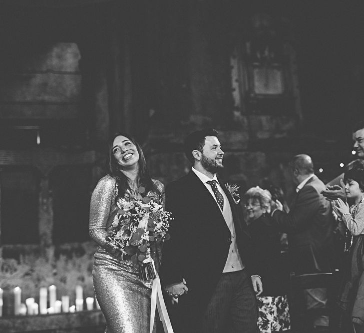 Bride In Gold Sequinned Dress For A Relaxed Wedding At Asylum Chapel With Bridesmaids In Mismatched High Street Dresses And Images by Lovestruck Photography