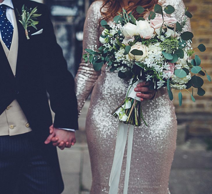 Bride In Gold Sequinned Dress For A Relaxed Wedding At Asylum Chapel With Bridesmaids In Mismatched High Street Dresses And Images by Lovestruck Photography