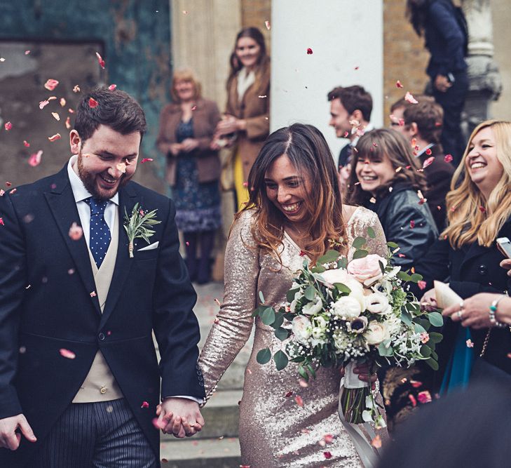 Bride In Gold Sequinned Dress For A Relaxed Wedding At Asylum Chapel With Bridesmaids In Mismatched High Street Dresses And Images by Lovestruck Photography