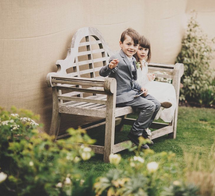 Flower Girl & Page Boy on a Bench