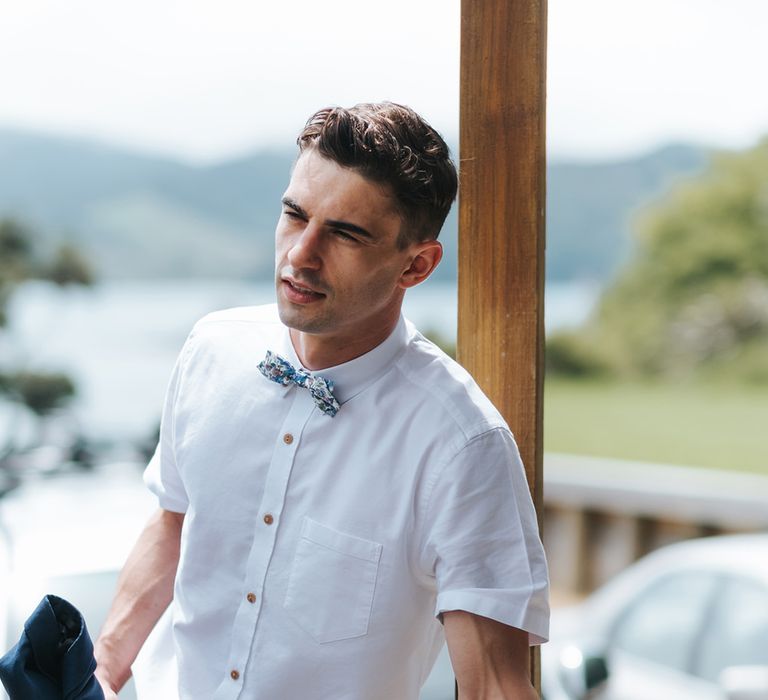 Groomsman in Chinos and Bow Tie | Outdoor Coastal Wedding at Ohawini Bay in New Zealand with Natural Garden Party Reception | Miss Gen Photography