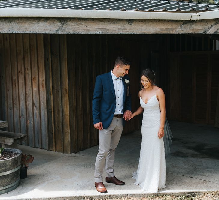 First Look | Bride in Sally Eagle 'Estelle' Gown | Groom in Chinos & Blazer | Outdoor Coastal Wedding at Ohawini Bay in New Zealand with Natural Garden Party Reception | Miss Gen Photography