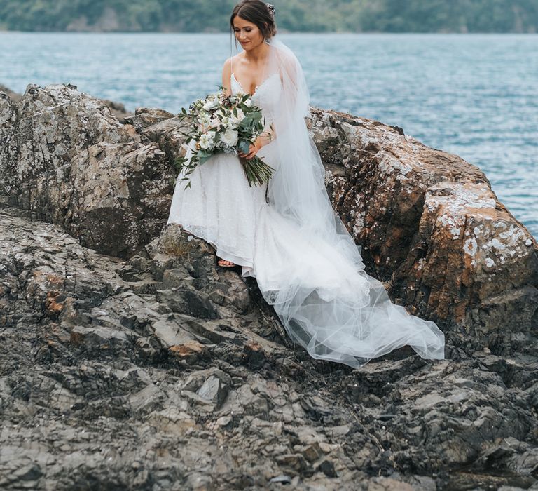 Bride in Estelle Sally Eagle Gown | Outdoor Coastal Wedding at Ohawini Bay in New Zealand with Natural Garden Party Reception | Miss Gen Photography