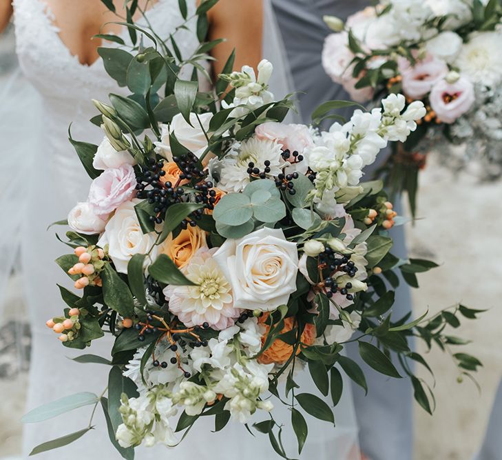 Bridal Bouquet | Bride in Estelle Sally Eagle Gown | Bridesmaids in Powder Blue Evolution Clothing Dresses | Outdoor Coastal Wedding at Ohawini Bay in New Zealand with Natural Garden Party Reception | Miss Gen Photography