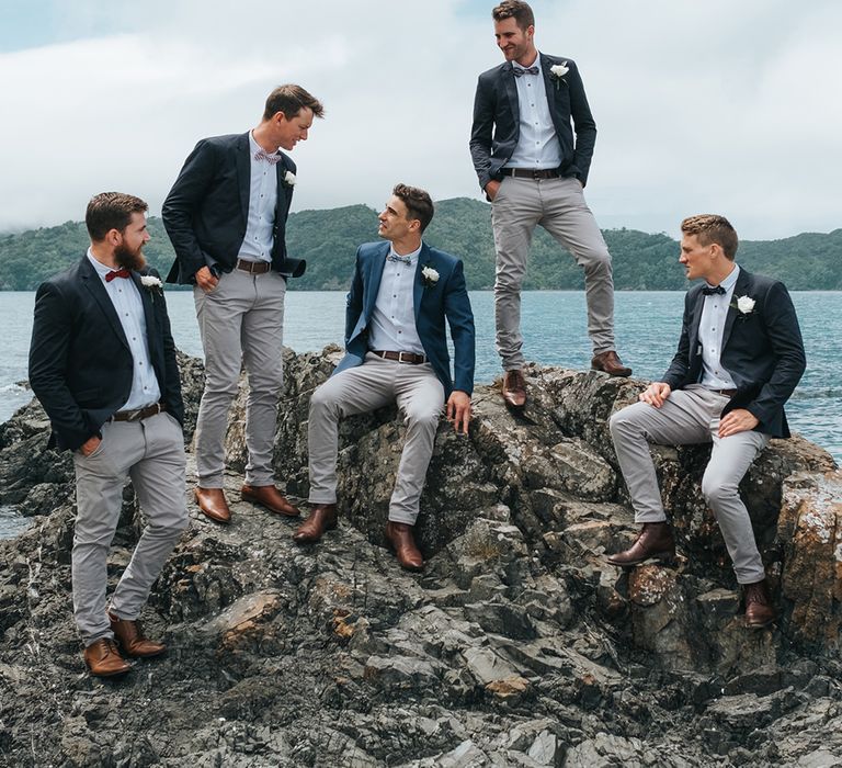 Groomsmen in Grey Chinos & Navy Blazers | Outdoor Coastal Wedding at Ohawini Bay in New Zealand with Natural Garden Party Reception | Miss Gen Photography