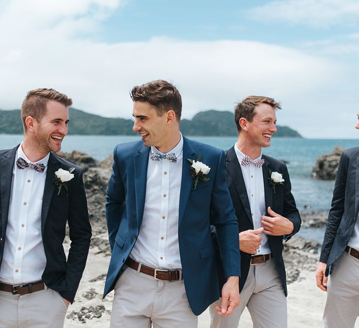 Groomsmen in Grey Chinos & Navy Blazers | Outdoor Coastal Wedding at Ohawini Bay in New Zealand with Natural Garden Party Reception | Miss Gen Photography